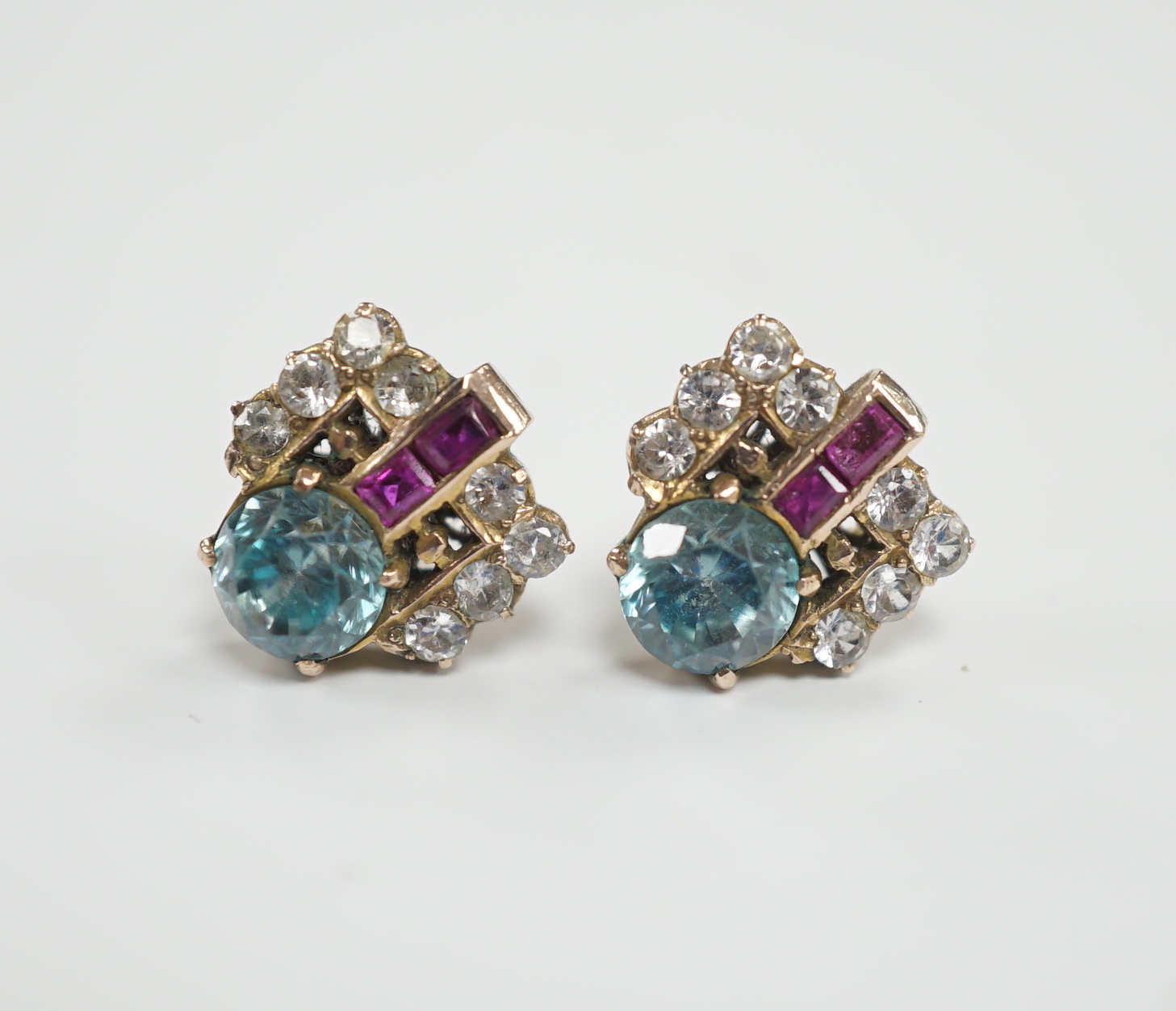 A pair of Art Deco yellow metal, blue zircon and two colour paste set cluster ear studs, 11mm, gross weight 4 grams.